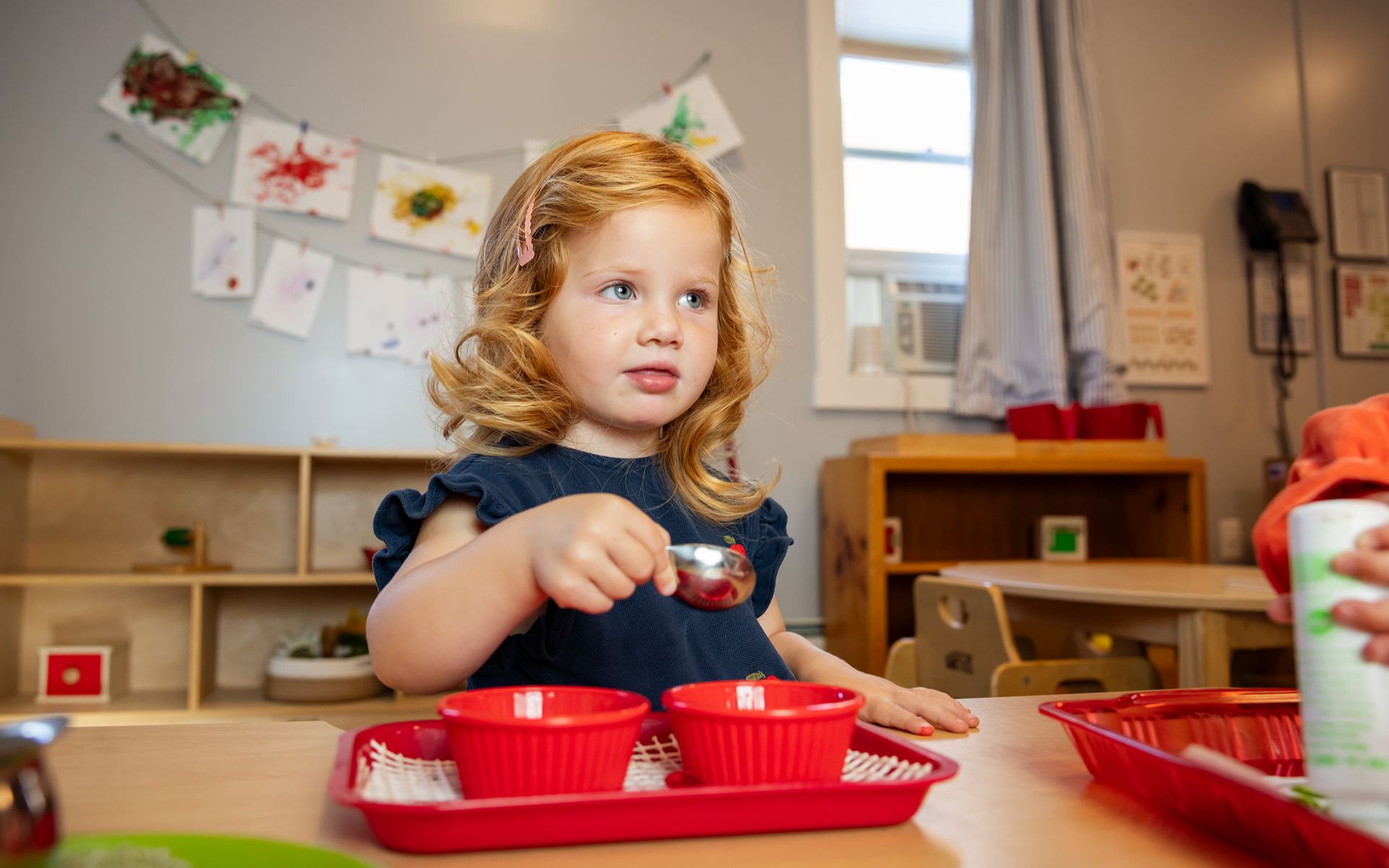 Toddler engaged in a hands-on learning activity