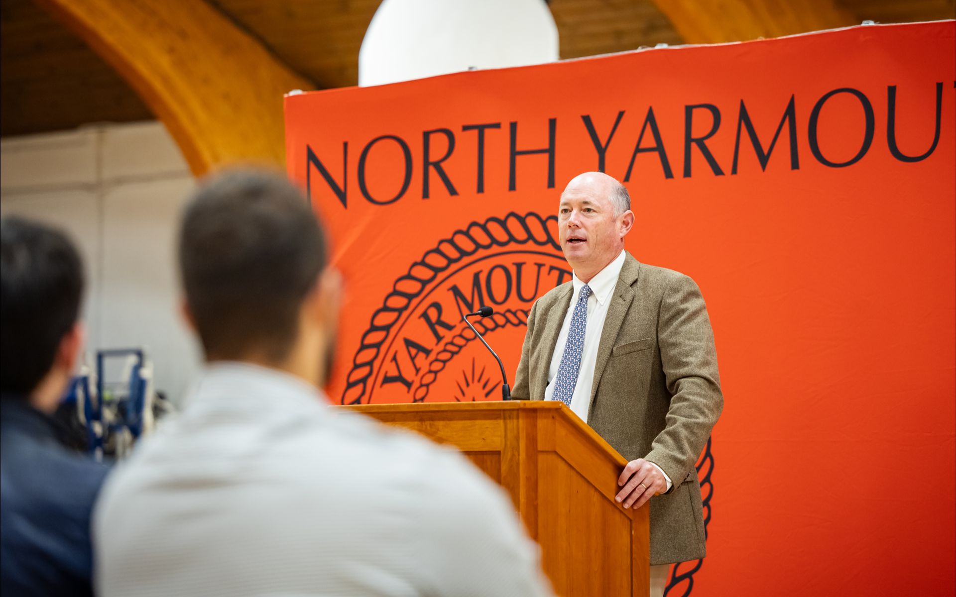 Headmaster giving a speech at a school event
