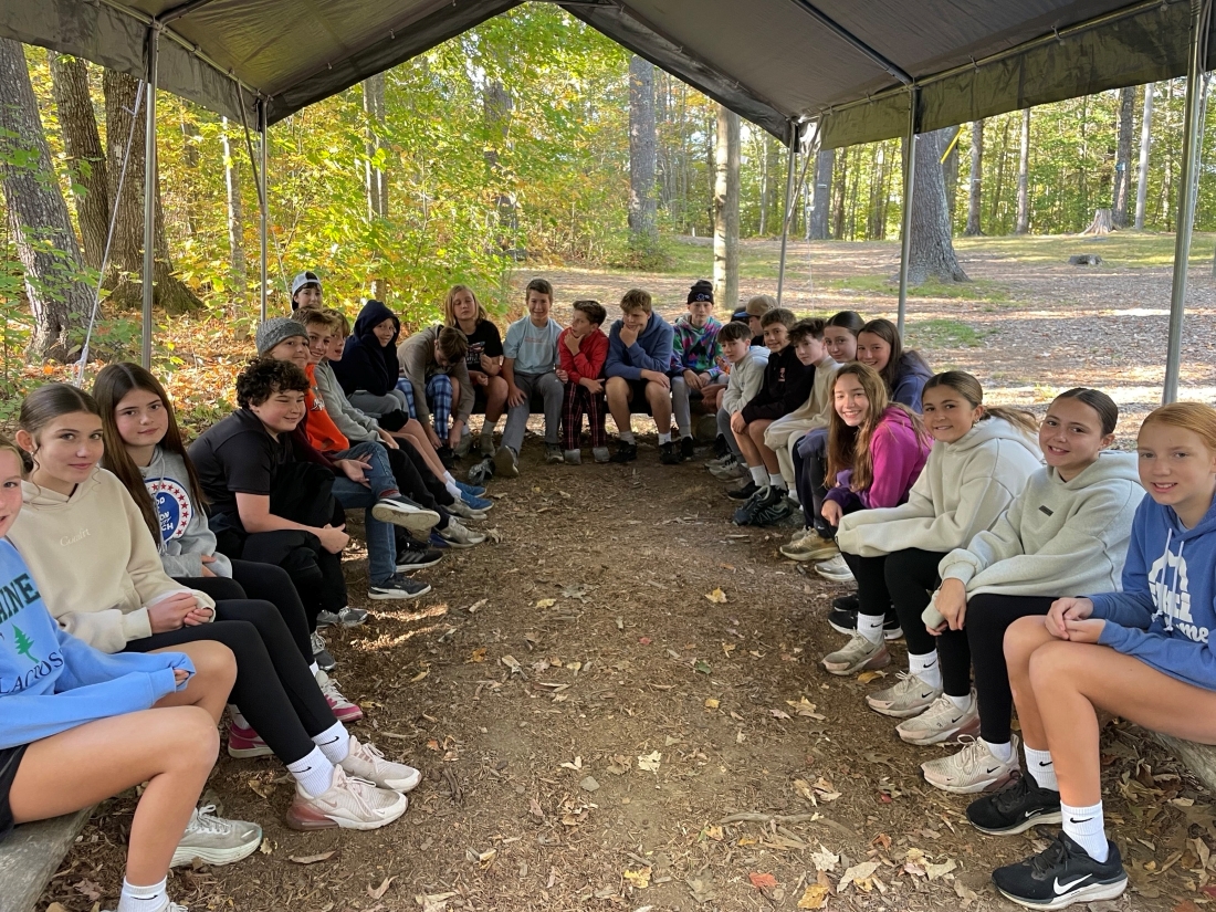 Students under a canopy on class overnight