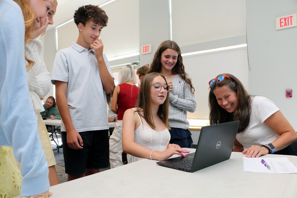 Students learning financial literacy hands-on in the Sheldon MINT Lab