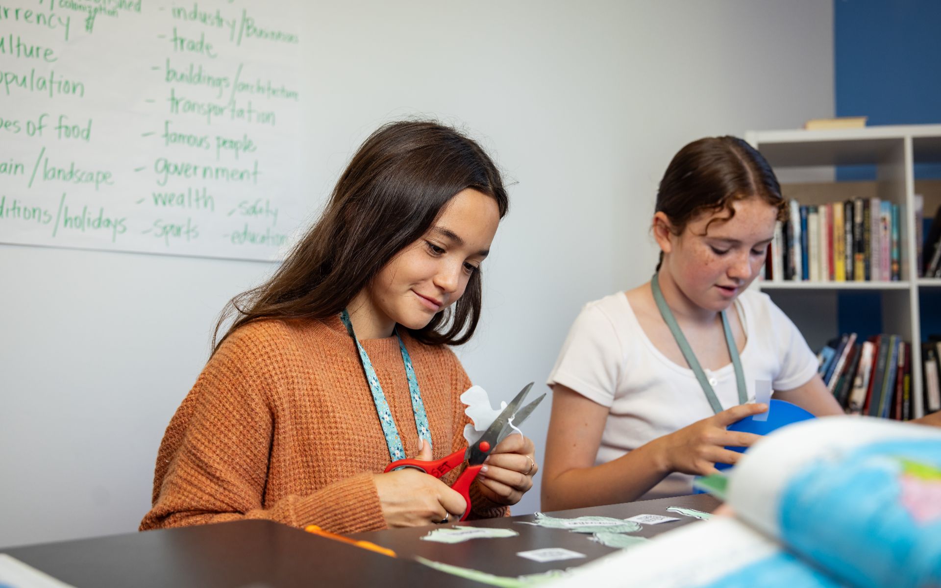 Students working on a hands-on geography project in a classroom